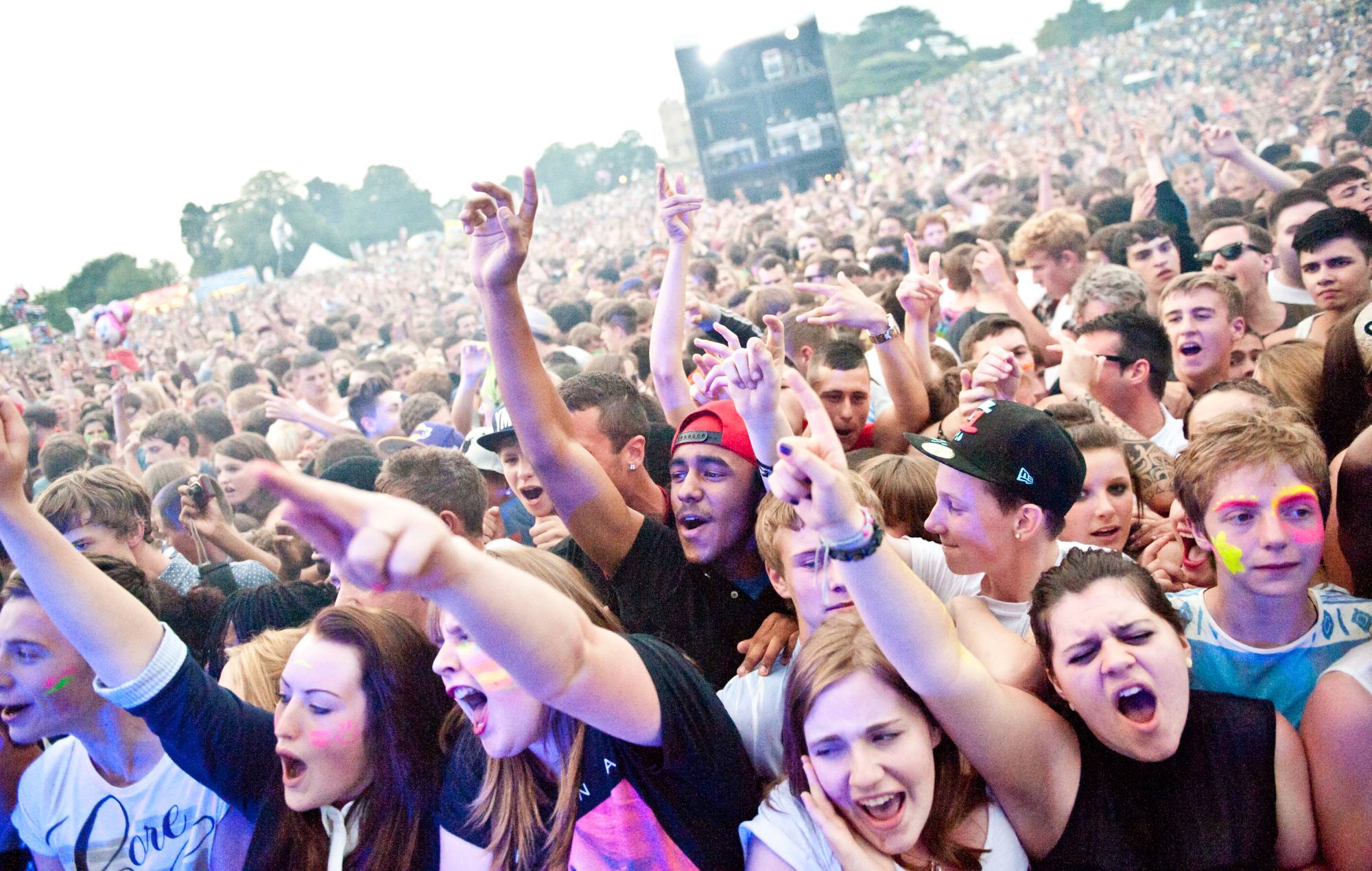 The crowd watch on as Dizzee Rascal performs on stage headlining Splendour Festival at Wollaton Park on July 21, 2012 in Nottingham, United Kingdom. (Photo by Ollie Millington/Redferns via Getty Images)