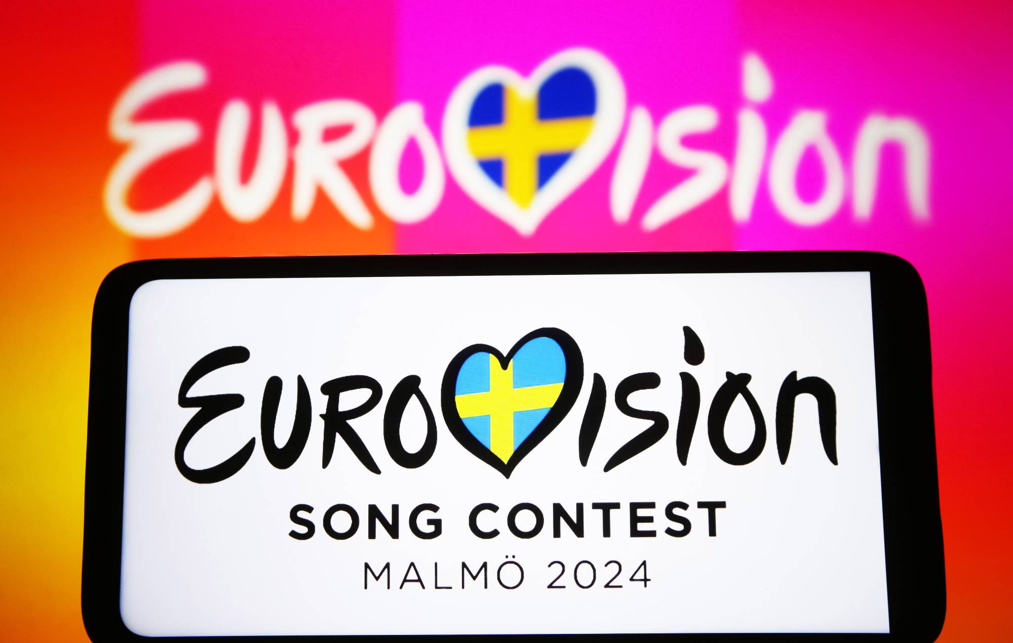 In this photo illustration, Eurovision Song Contest 2024 (ESC) logo is seen on a smartphone and a pc screen. The Eurovision Song Contest 2024 is scheduled to take place in May 2024 in Malmo Sweden. (Photo Illustration by Pavlo Gonchar/SOPA Images/LightRocket via Getty Images)