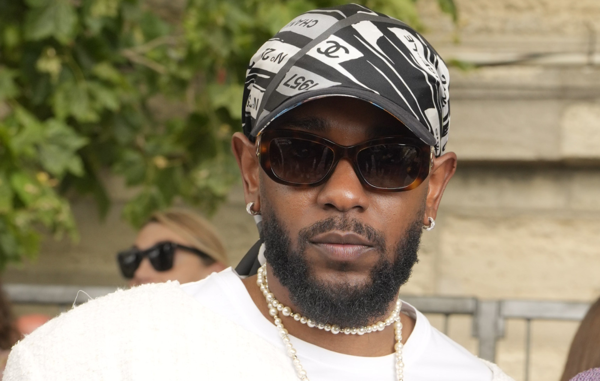 Kendrick Lamar at the Chanel runway show in July 2023. Photo credit: Swan Gallet/WWD via Getty Images