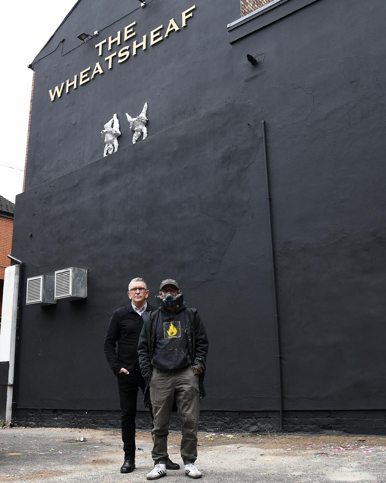 Mike Joyce with artist Akse outside the proposed location of the mural in Manchester's Northern Quarter. Credit: Sal Thompson - GigJunkie