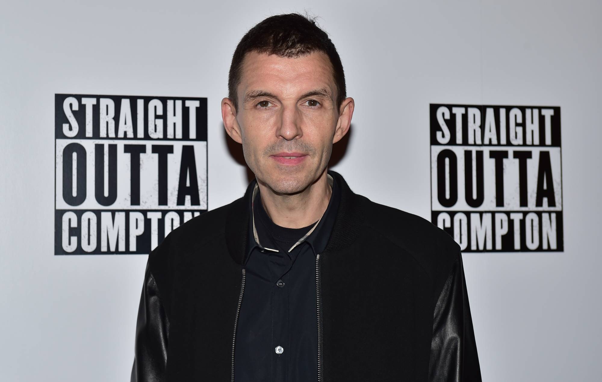 Tim Westwood poses for a photograph on the red carpet after arriving for the gala screening of the film Straight Outta Compton, at the Picturehouse Central cinema in central London, on August 20, 2015. AFP PHOTO / LEON NEAL (Photo credit should read LEON NEAL/AFP via Getty Images)