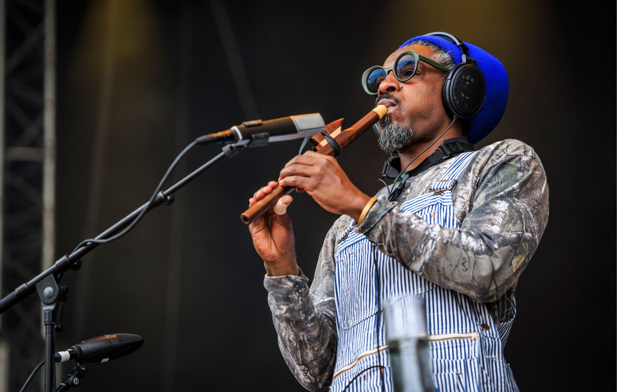 Andre 3000 performs on stage in 2024