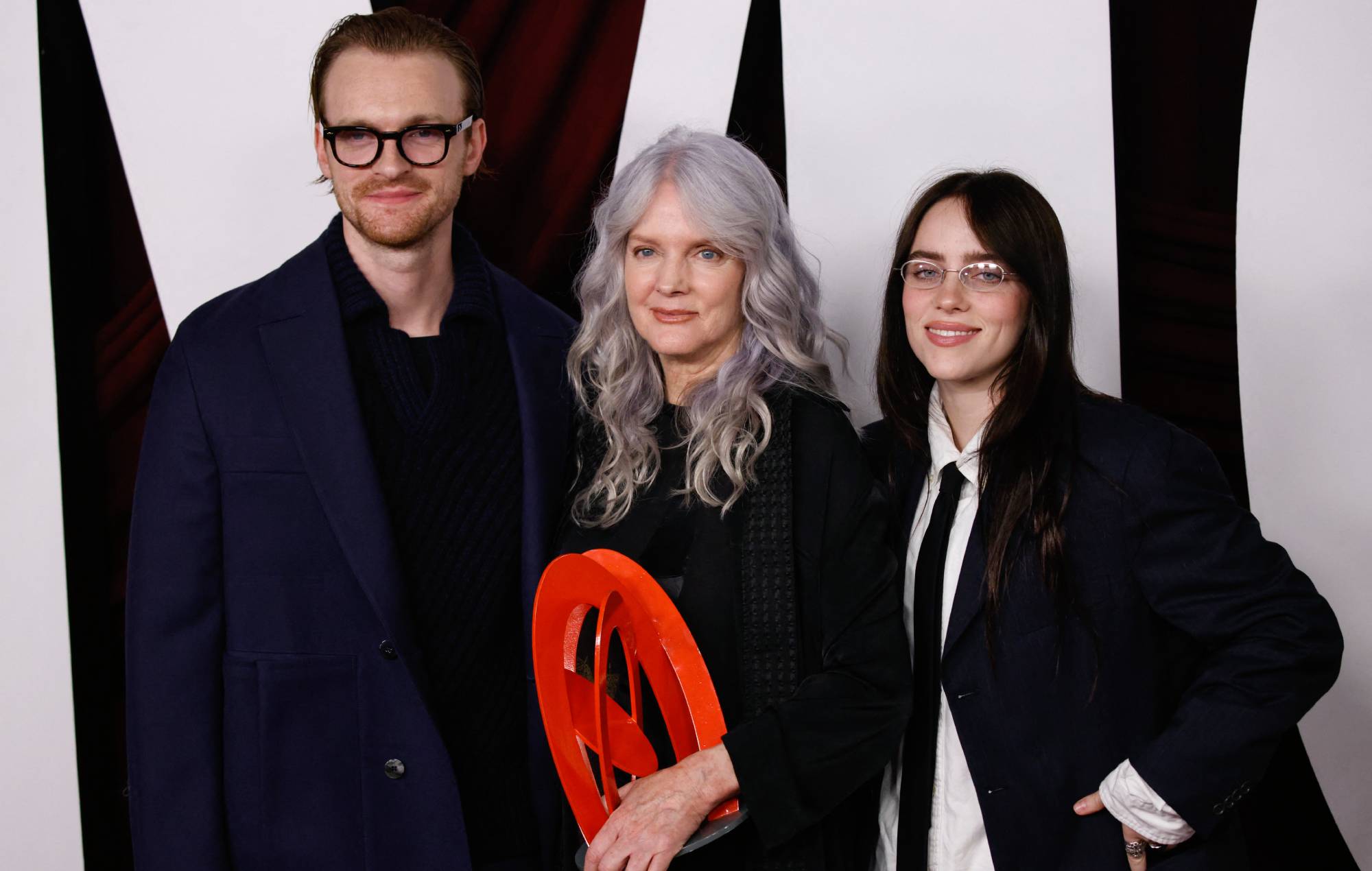 Billie Eilish with her mom Maggie Baird and brother US singer-songwriter Finneas O'Connell. (Photo by KENA BETANCUR/AFP via Getty Images)