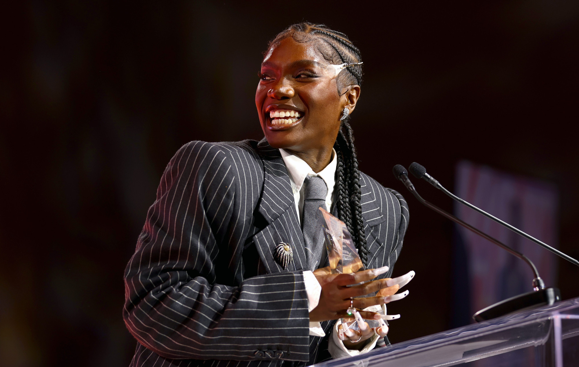 Doechii accepting award for 'Hip-Hop Disruptor of the Year' at the 2024 Variety Hitmakers' Brunch. Photo credit: Joe Scarnici/Variety via Getty Images